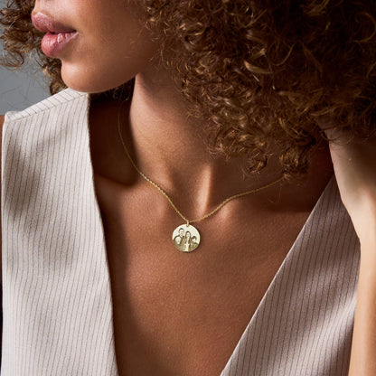 Close-up of a personalized engraved portrait disc pendant, 14K gold vermeil photo necklace