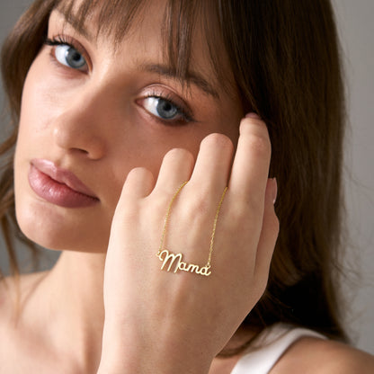 Dainty Mama, Nana and Mom name necklaces in 14K gold vermeil, worn on model, close-up of the name pendant (11)