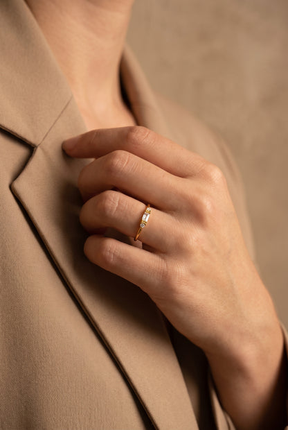 Baguette and round lab-grown diamond ring in 14K solid gold, worn on hand