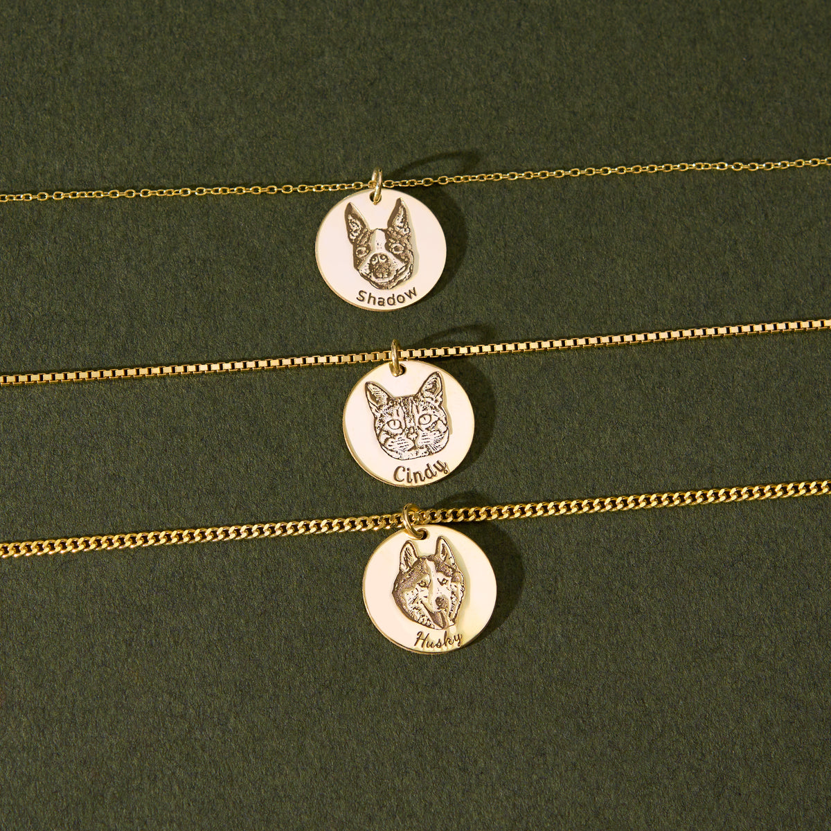 Three custom portrait disc pendants engraved with pet and family photos on 14K gold vermeil chains