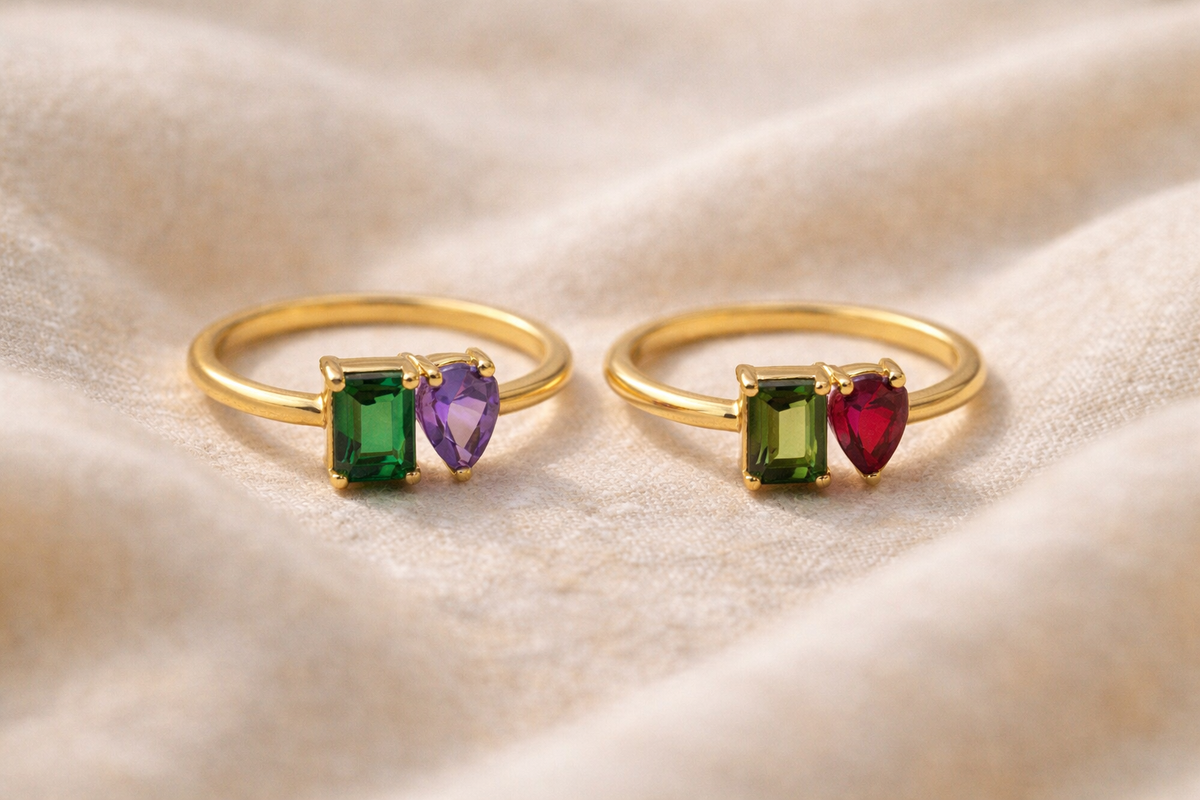 Toi et Moi birthstone ring with emerald-cut and pear-cut zirconia stones, close-up
