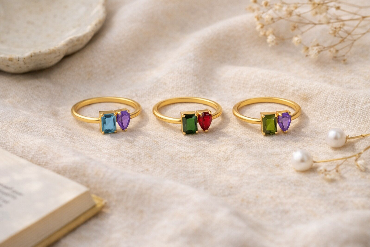 Toi et Moi ring with emerald-cut and pear-cut birthstone colored zirconia
