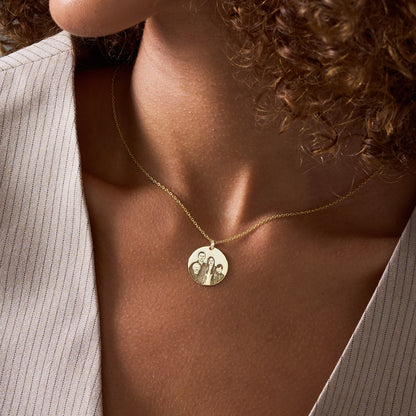 Woman wearing a 14K gold vermeil custom pet portrait necklace with an engraved dog photo disc pendant
